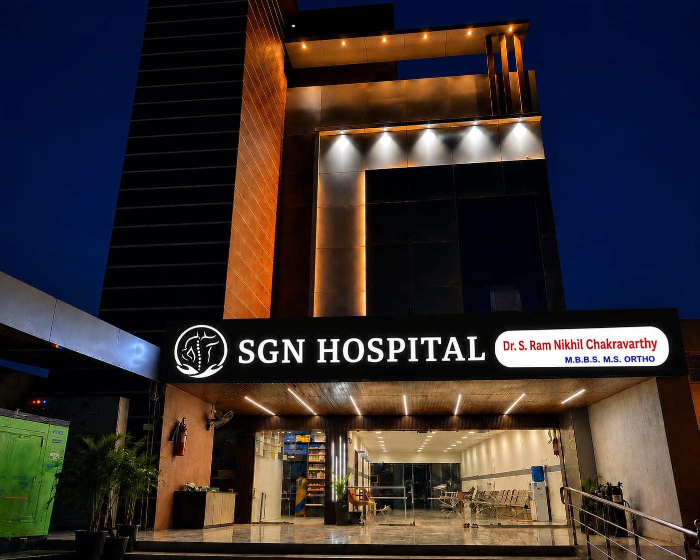 SGN Hospital building exterior at night with illuminated signboard
